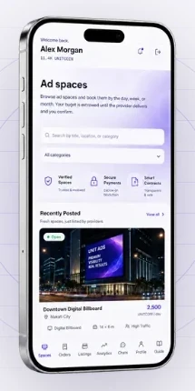 Unit Ads on mobile: the ad-space catalogue showing a listing for a downtown digital billboard in Makati City at 2,500 UNITCOIN.